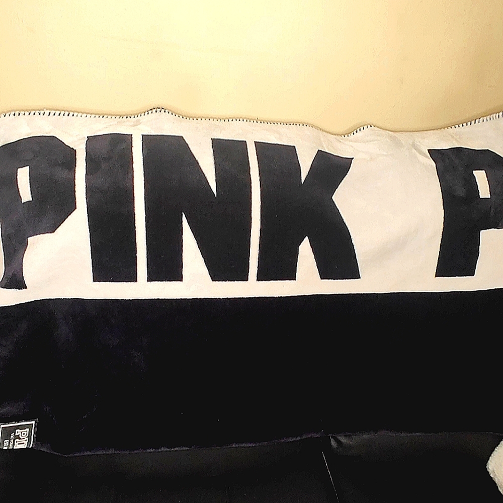 Sherpa Victoria's Secret PINK blanket solid black with white margins.
